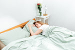 Novaline weighted blanket with cotton cover, green, woman sleeping